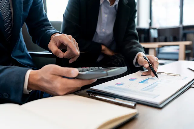 Stock vs. Custom Photography in 2026: A Practical Guide to Cost, Speed, and ROI 10 businessmen calculating costs